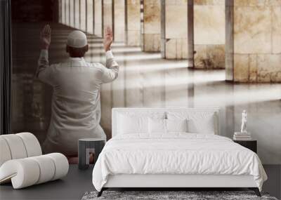 Religious muslim man praying Wall mural