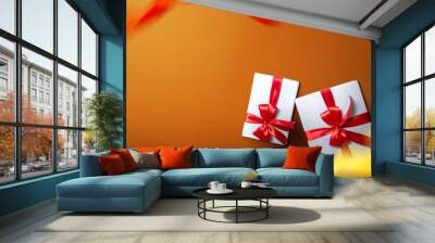 White gift box with red ribbon with a colored background Wall mural