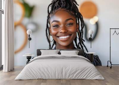 Smiling woman with natural hair in a bright environment symbolizing joy authenticity and the celebration of natural beauty in a modern joyful setting Wall mural