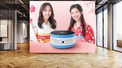 Two women dressed in traditional Japanese clothing with a modern twist sitting with a smart home device symbolizing the fusion of cultural heritage and contemporary technology Wall mural