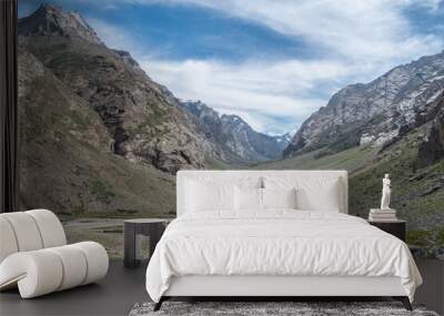 A dirt road through a field with mountains in the background, Zanskar, Himalayas Wall mural