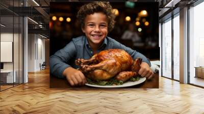 Happy boy with roast turkey in a restaurant.Front view
 Wall mural