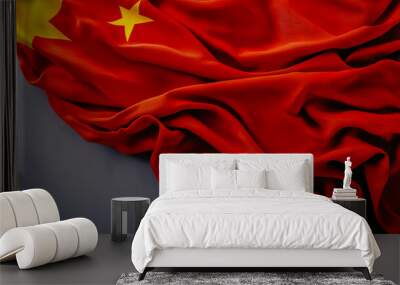 A waving colorful national flag of China set against a gray background. Wall mural