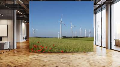 Windmill generator in wide yard / Yard of windmill power generatorunder blue sky, shown as energy industry concept. Wall mural