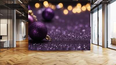 A purple christmas background glitters are scattered on a wooden surface with purple glitter. Wall mural