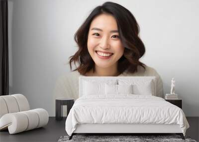 portrait of a Japanese woman in her 30s wearing a cozy sweater against a white background Wall mural