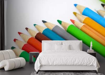 Colouring pencils on a white background Wall mural