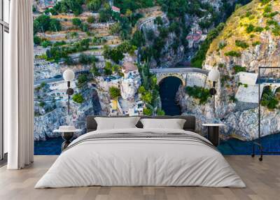 The Amalfi Coast is a breathtaking stretch of coastline in southern Italy, known for its vertiginous cliffs adorned with colorful villages, turquoise waters, and lush terraced gardens.  Wall mural