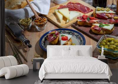 Exquisite still life of wine, cheese and meat products, olives, seeds and wine Wall mural