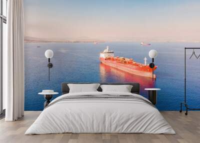 Aerial view of industrial crude oil fuel tanker ship anchored in deep blue Wall mural