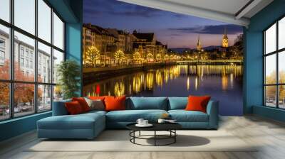 Zurich on banks of Limmat river at winter evening Wall mural