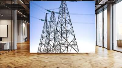 High voltage transmission on industrial electricity line tower. Energy technology with overhead power line Wall mural