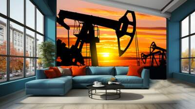 Industrial landscape. Oil Field. Oil pumps against the setting sun. Wall mural