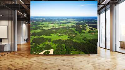 aerial view of a green rural area under blue sky Wall mural