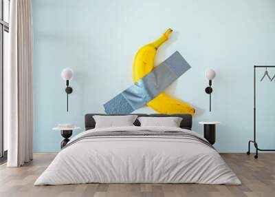 A banana taped to the white wall. Wall mural