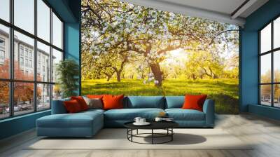 Splendid ornamental garden with blooming lush trees on a sunny day. Wall mural