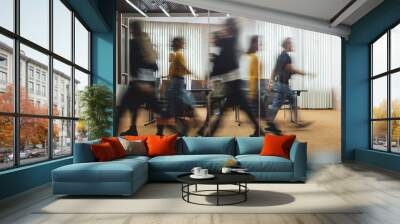 Businesspeople walking at modern office. Group of business employees at coworking center. Motion blur. Concept work process. Wide image Wall mural