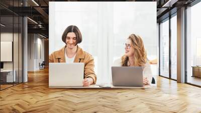 Wide shot. Office team having meeting and discussing at coworking space. Group of business people working new strategy of company Wall mural