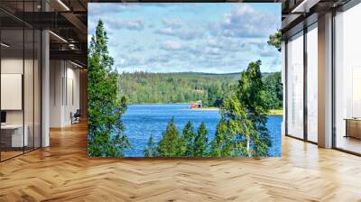 summery view across the lake Gissen with bath hut near Vimmerby in the region Kalmar Län (Smaland), Sweden Wall mural