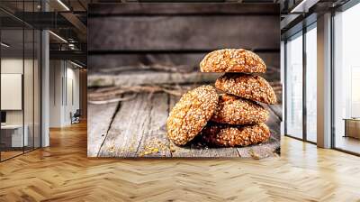 Homemade cookies with sesame, dark wood background, selective focus Wall mural