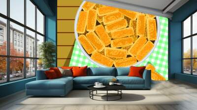 Kastengel is a pastry made from a mixture of flour, eggs, margarine, and grated cheese. This cake is rectangular, about 3-4 cm long and 1 cm wide, and baked in the oven until golden yellow. Wall mural