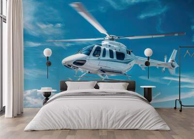 Aerial view of a white business helicopter flying through a clear blue sky on a sunny day Wall mural