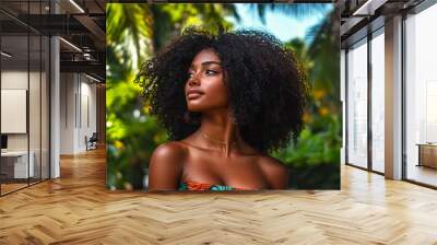 Barbadian woman with curly hair enjoys the lush outdoor environment Wall mural