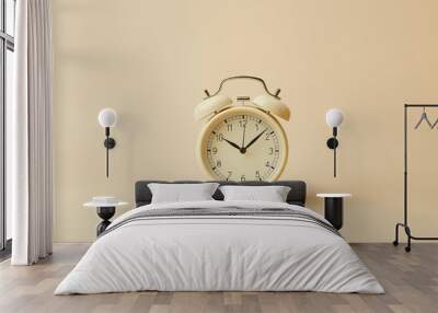 classic retro alarm clock sits on a plain background, simple design and charm Wall mural