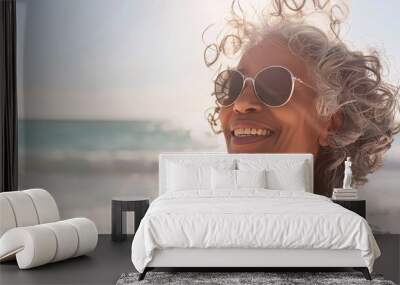 Joyful Mature African American Woman Enjoying Sunny Beach Day Wall mural