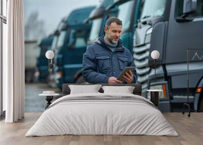 Logistics Professional with Tablet at Truck Fleet Wall mural