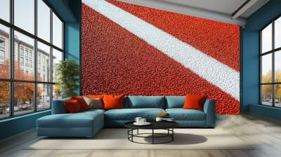 Textured red rubber surface with sharp white line creates striking visual contrast, ideal for sports and athletic themes. vibrant colors evoke energy and movement Wall mural