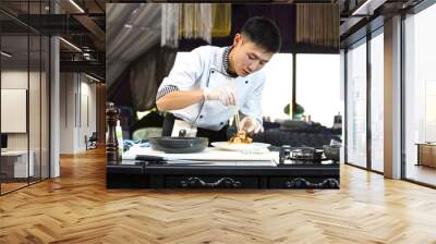 Japanese chef preparing a meal in a restaurant Wall mural