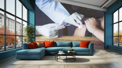 Selective focus,Doctor inject vaccine to patient. Wall mural