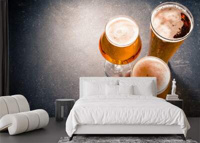 Beer glasses on dark table Wall mural