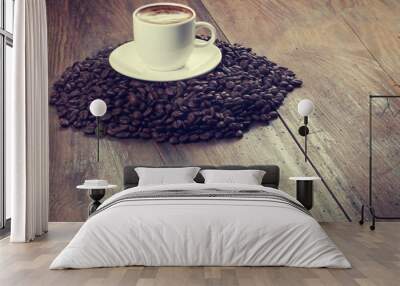 Coffee cup and coffee beans on a wooden table Wall mural