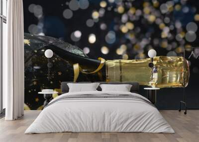 New Year concept, with bright light and champagne glass, abstract bokeh background Wall mural