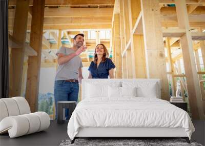 Couple make their dreams of building their own home come true visiting house under construction Wall mural