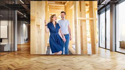 Couple make their dreams of building their own home come true visiting house under construction Wall mural