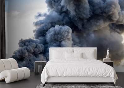 Huge black smoke cloud from fire Wall mural