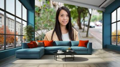 Asian woman smile to camera at outdoor Wall mural