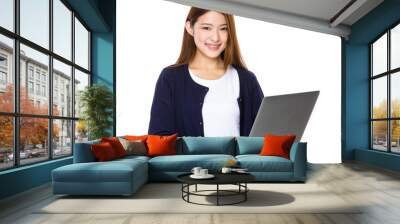 Attractive smiling young woman holding laptop computer Wall mural