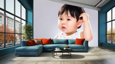 Baby boy scratch head Wall mural