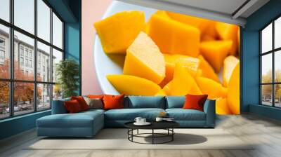 Diced fresh mango fruit on plate Wall mural