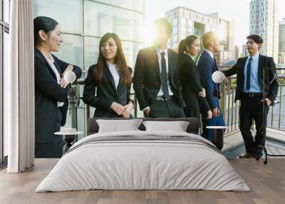 Group of business people talking outside office Wall mural