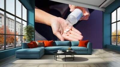 Pills on the hand with the bottle Wall mural