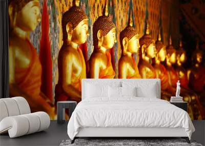 row of golden buddha statue Wall mural