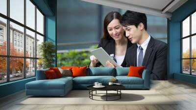 two business people use of the digital tablet Wall mural