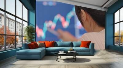 Woman study the stock market data Wall mural