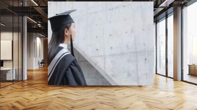 Woman think of the future after graduation Wall mural