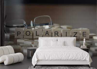 The concept of Polarize represented by wooden letter tiles Wall mural